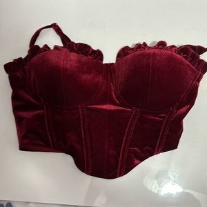 Has padding, adjustable straps, dark red